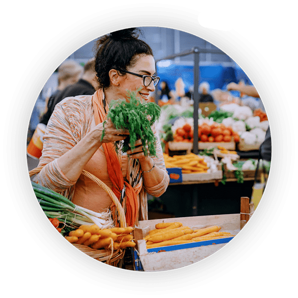 An informed shopper carefully selects some produce